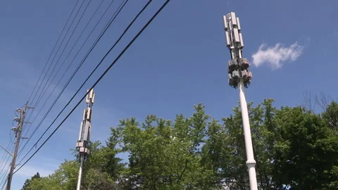 Toronto, On, Aug 1 2026 Cell tower with multiple antennas on it in the city Stock Footage 341027489