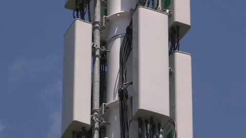 Toronto, On, Aug 1 2026 Cell tower with multiple antennas on it in the city Stock Footage 341027491