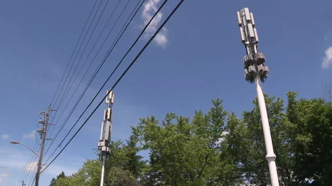 Toronto, On, Aug 1 2026 Cell tower with multiple antennas on it in the city Stock Footage 341027492