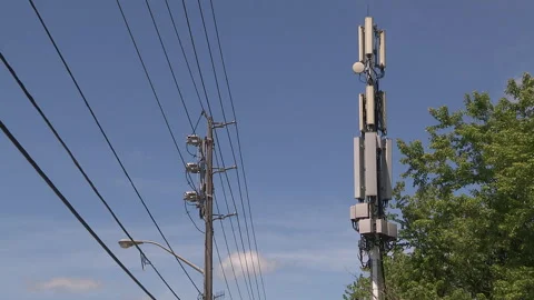 Toronto, On, Aug 1 2026 Cell tower with multiple antennas on it in the city Stock Footage 341027524