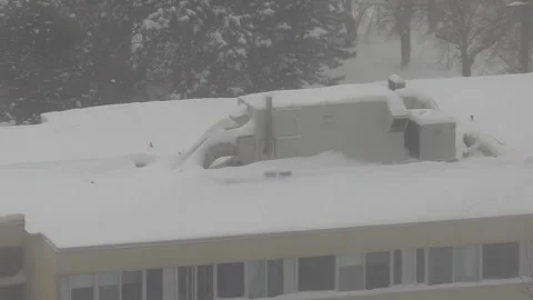 Toronto, Ca, March 31 2025 Winter blizzard, snow blocks emergency exits Stock Footage 303385018