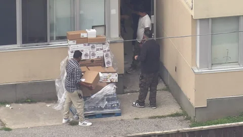 Toronto, Can,  Aug 3 2026 Food arrives at full city homeless shelter 스톡 동영상 344454708