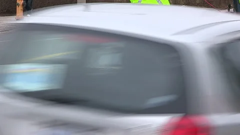 Toronto, Can,  May 5 2026 Workers fill potholes on city streets with asphalt Stock Footage 340910580