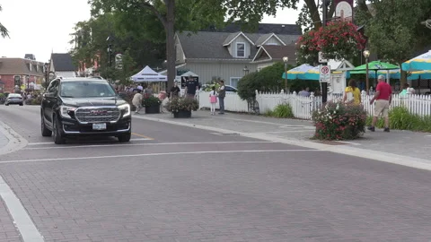 Toronto, Can Sep 8 2026 Busy city intersection with cars and people Stock Footage 344984008