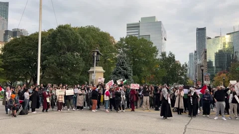 Toronto, Canada - 18 October 2023: Streets of Toronto Resound: The Heartfelt Stock Footage 253464430