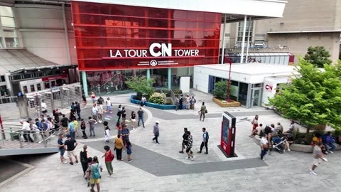 TORONTO, CANADA - 2024 August 4 : summer life beneath CN Tower Stock Footage 280942250