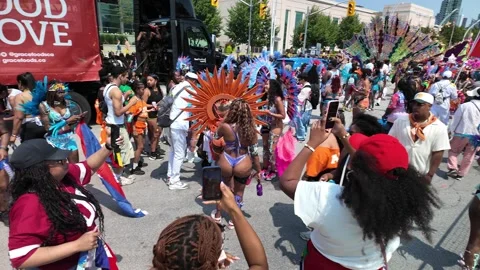 Toronto, Canada 2025 August 2: people filming Caribbean Carnival parade Stock Footage 314200971