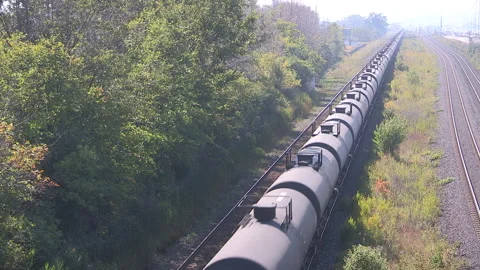 Toronto, Canada, Aug 1 2026 Crude oil tanker train move through city Stock Footage 341028459