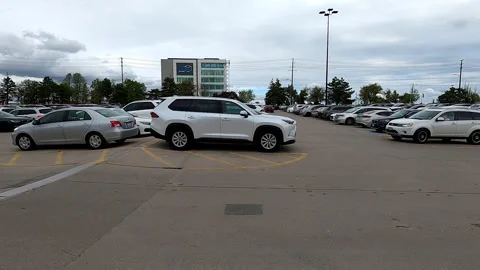Toronto, Canada, Aug 12  2025 POV side view driving suburban mall parking lot Stock Footage 309461305