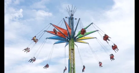 Toronto, Canada - August 29, 2026: Swing carousel ride with riders high above Stock Footage 344092774