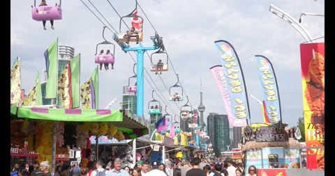 Toronto, Canada - August 29, 2026: Swing carousel ride with visitors flying Stock Footage 344092940