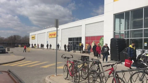 Toronto, Canada - June 19 2020: Customers line up to enter a grocery store one Stock Footage 133611253