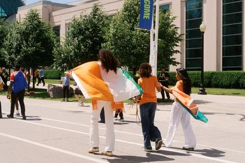 Toronto, Canada - June 20, 2026: Ivory Coast soccer fans walking with flags Фото