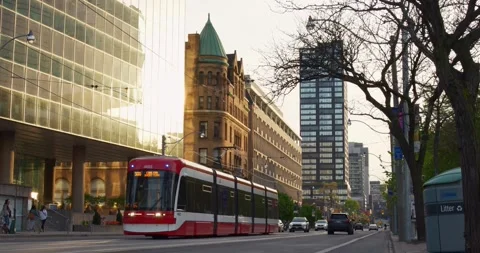 Toronto, Canada - May 6, 2023: Tram seamlessly blends city architecture Stock Footage 257592183