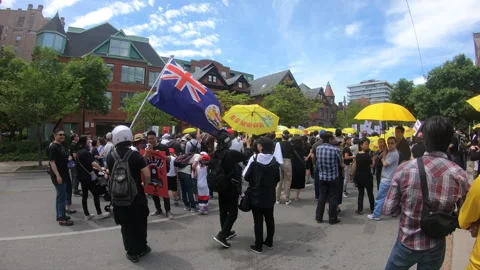 Toronto, Canada Oct 12 2014 Yellow Umbrella March for Hong Kong freedom Stock Footage 345761277