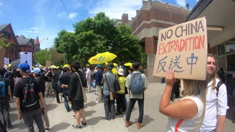 Toronto, Canada Oct 12 2014 Yellow Umbrella March for Hong Kong freedom Stock Footage 345761281