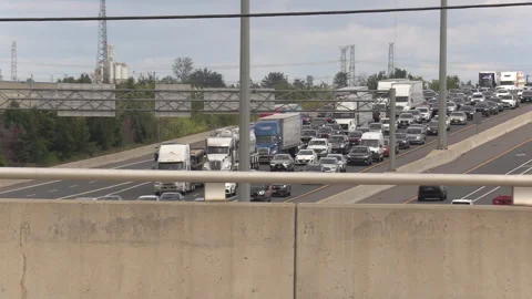 Toronto, Canada, Sep 8 2026 Traffic jam gridlock on highway 401 Видео 345151273