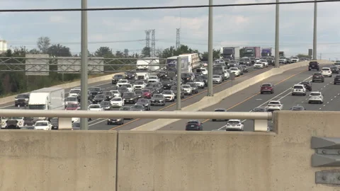 Toronto, Canada, Sep 8 2026 Traffic jam gridlock on highway 401 Видео 345151883