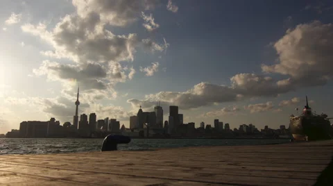 Toronto Cityscape Viewed from a Dock During the Evening : Time Lapse Stock Footage 64531897