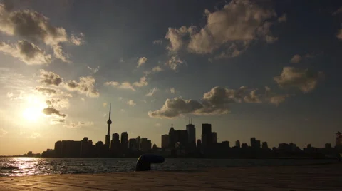 Toronto Cityscape Viewed from a Dock at Sunset : Time Lapse Stock Footage 64532050