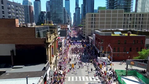 Toronto Downtown Skyline Overlooking Pride Parade from Above 스톡 동영상 337912626