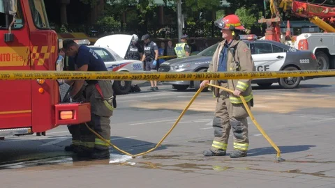 Toronto Emergency Crime Scene Intersection Firemen Wrap Hose Yellow Police Ta Video stock 91015164