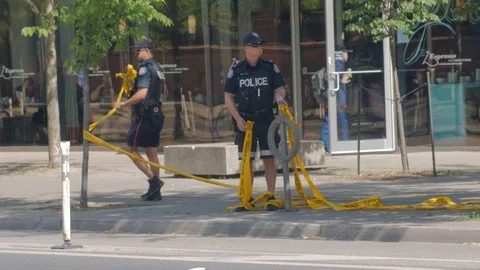 Toronto Emergency Crime Scene Intersection Police Cops Collect Yellow Tape Ac Video stock 91015270