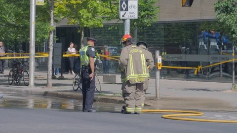 Toronto Emergency Crime Scene Intersection Police Talking Firemen Spraying Wa Video stock 91015438