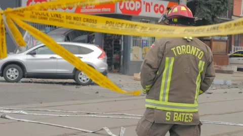 Toronto Fireman Looking Upon Car Crash Crime Scene Video stock 62776925