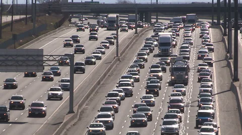 Toronto highway traffic jam at rush hour with sun reflecting off cars Stock Footage 49546113