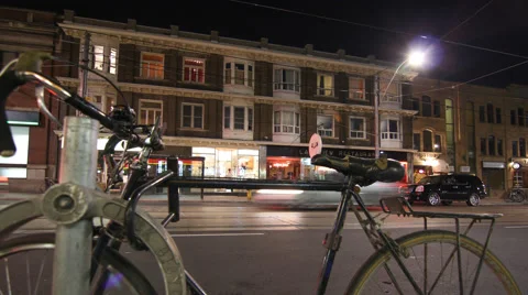 Toronto night traffic motion time lapse with bike in foreground 4K Stock Footage 68491605