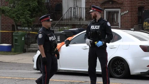 Toronto police at crime scene of drive b... | Stock Video | Pond5