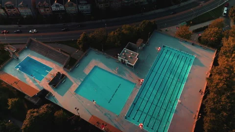 Toronto Public Outdoor Pool Complex Golden Hour Summer Aerial Drone 4K Stock Footage 335652827