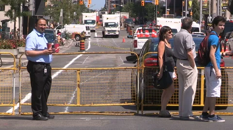 Toronto road construction in the summer on downtown streets Stock Footage 65562963