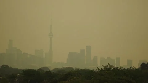 Toronto Skyline Under Wildfire Smoke, Orange Hazy Sky Stock Footage 342734308