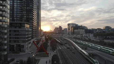 Toronto Sunset with GO Train leaving the city Stock Footage