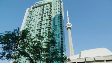 Toronto Tower Rising Behind Modern Condo Building in Downtown Toronto Stock Footage 328370756