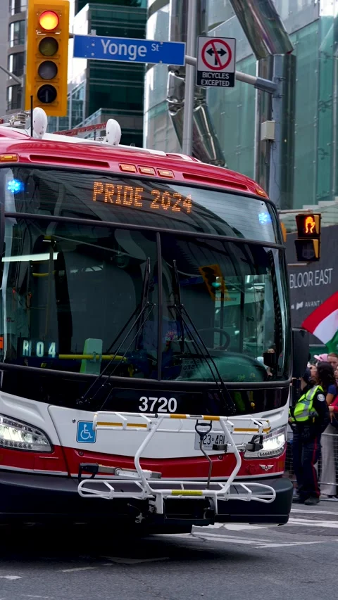 Toronto Transit Bus Displaying Pride 2024 Sign During Parade Stock-Footage 332018072