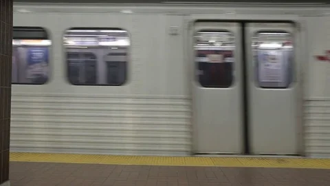 Toronto TTC subway pulls into station Stock Footage 77526187