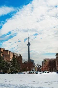 Toronto typical houses at winter and view of CN Tower Stock Photos
