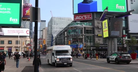 Toronto Yonge-Dundas Square traffic, LED billboards and pedestrians Stock Footage 321035668