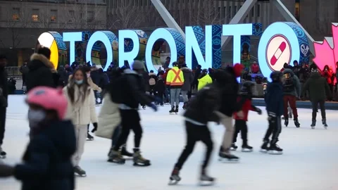 Torontonians skating at Nathan Phillips Square at  Christmas Eve Stock Footage 167441548