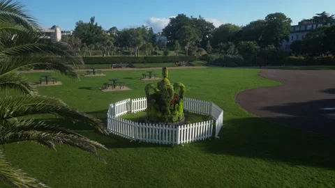 Torquay, Devon, England: DRONE VIEWS: A Topiary Crown honouring King Charles III Stock Footage 247489964