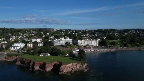 Torquay, S. Devon, England: DRONE VIEWS: Corbyn Head and Beach &amp; the Grand Hotel Stock Footage 246536857