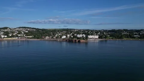 Torquay, S. Devon, England: DRONE VIEWS: Corbyn Head and Beach &amp; the Grand Hotel Stock Footage 246538889