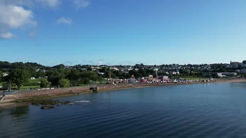Torquay, South Devon, England: DRONE VIEWS: Seafront &amp; the Summer Funfair Stock Footage 247490508