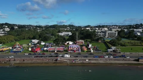 Torquay, South Devon, England: DRONE VIEWS: Funfair, Seafront, Conference Centre Stock Footage 247490965