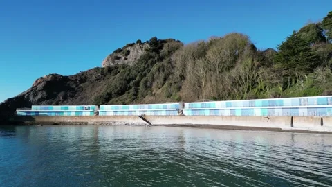 Torquay, Torbay, S. Devon, England: DRONE VIEWS: Meadfoot Beach &amp; Beach Chalets Stock Footage 273859222
