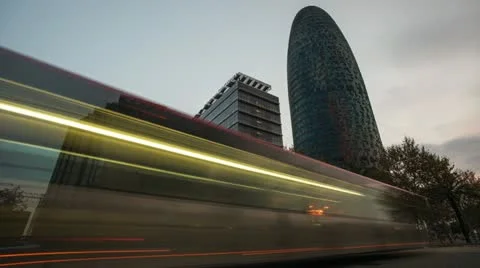 Torre Agbar office building, illuminated at night, in Barcelona, Spain Stock Footage