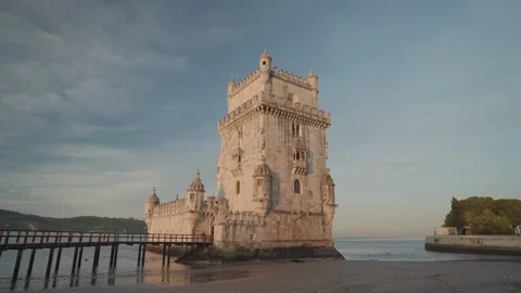 The Torre de Belem (Belem Tower) during sunrise Lisbon, Portugal Stock Footage 273434221